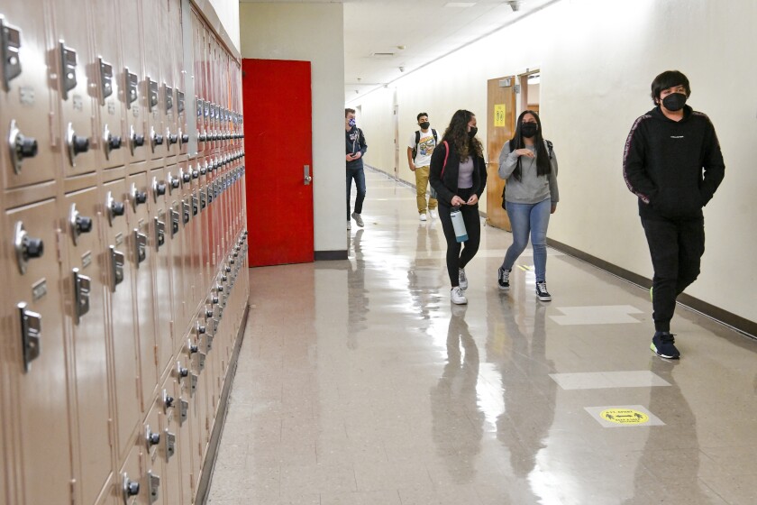 Students walk the hallway at Hollywood High School on April 27, 2021 in Los Angeles, California. 