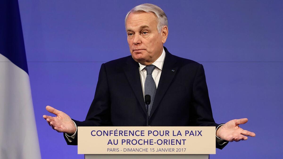 French Minister of Foreign Affairs Jean-Marc Ayrault addresses delegates at the opening of the Mideast peace conference in Paris on Jan. 15, 2017.