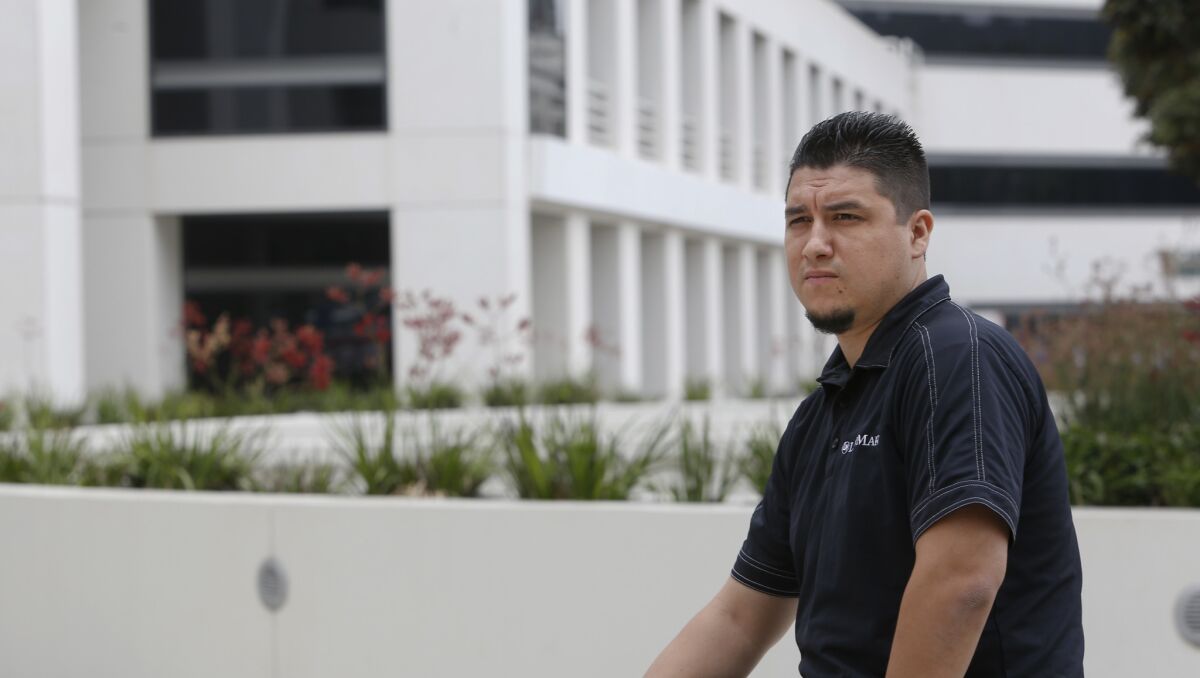 Jorge Villalba, shown in 2015 in front of the ITT Technical Institute in Encinco, left the school owing about $150,000 in student loans.