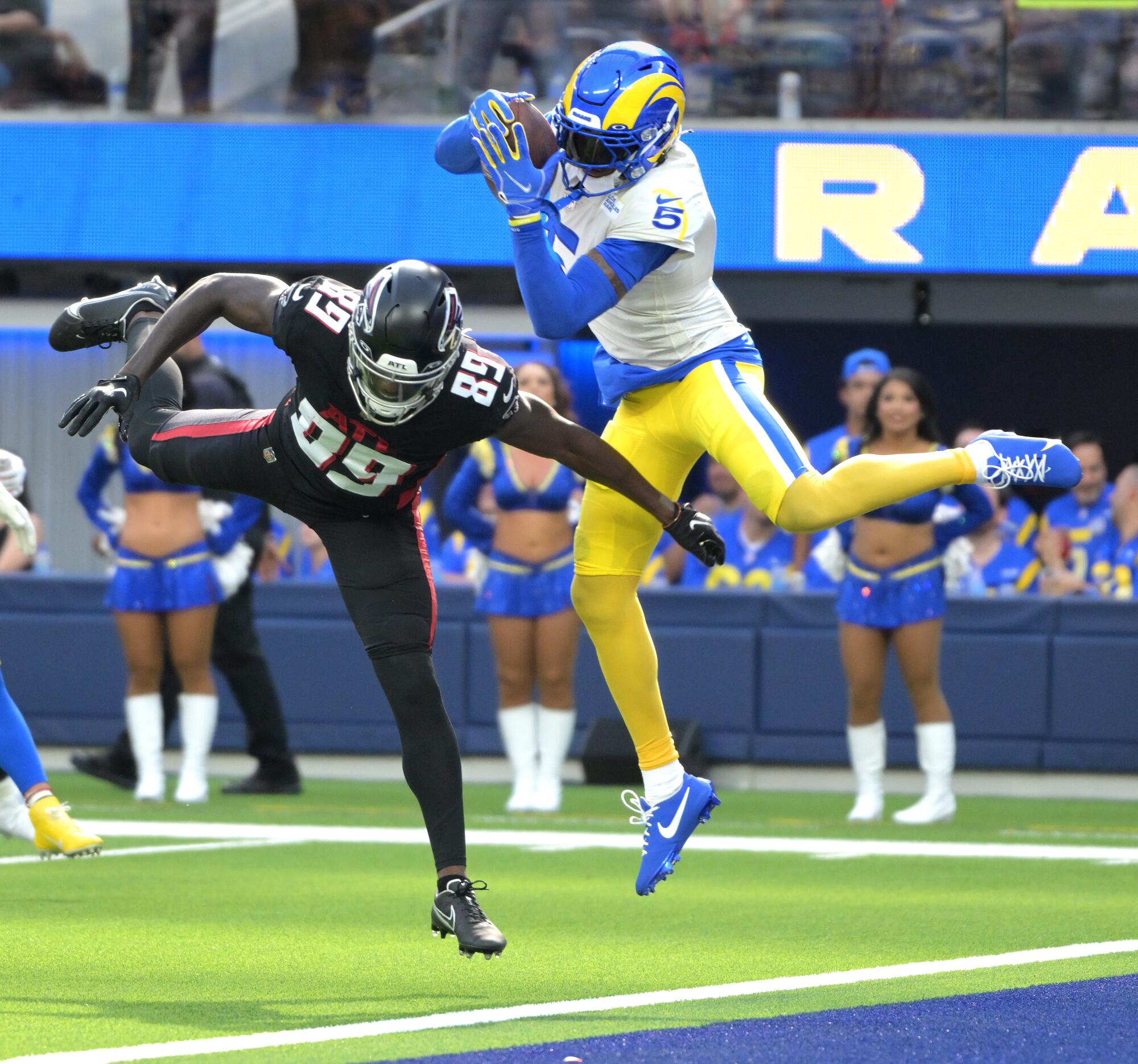 Rams defensive back Jalen Ramsey intercepts a pass in the end zone in front of Falcons receiver Bryan Edwards.