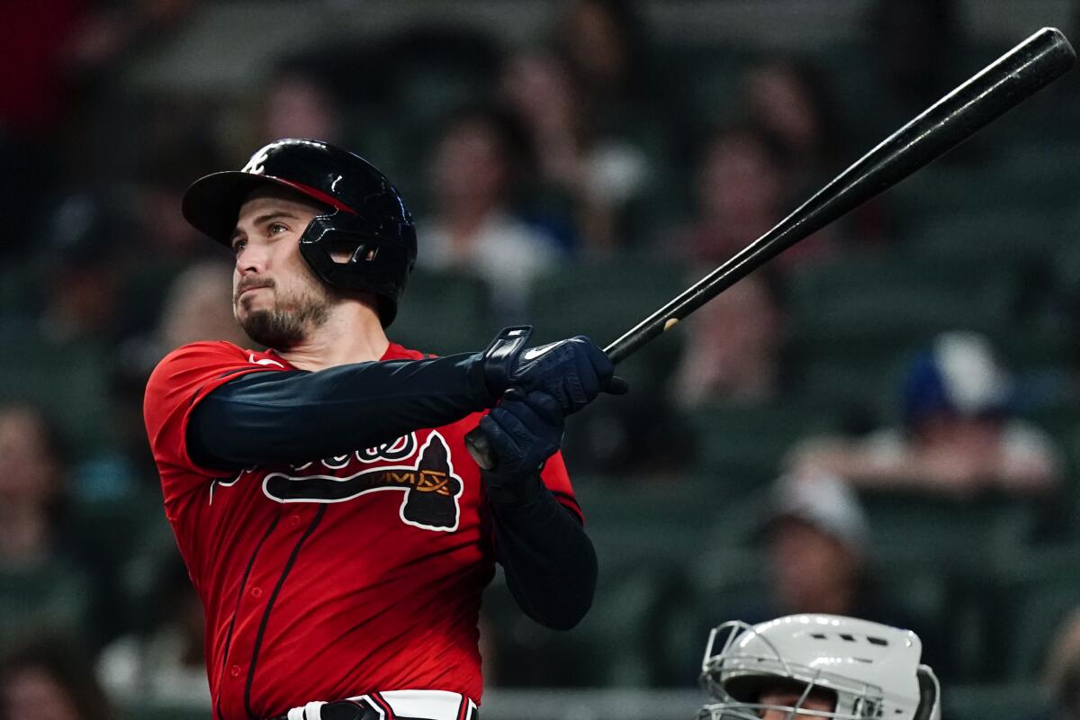 Atlanta Braves' Travis d'Arnaud watches his two-run home run during the fourth inning of the team's baseball game against the Miami Marlins on Friday, Sept. 2, 2022, in Atlanta. (AP Photo/John Bazemore)