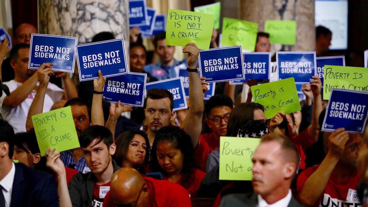 Opponents and supporters of emergency homeless shelters for Los Angeles pack a City Council meeting on Friday.