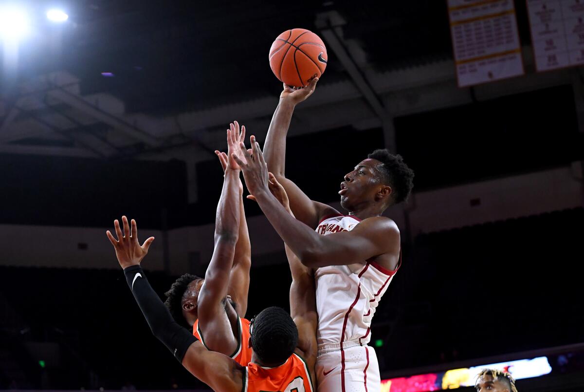 USC's Onyeka Okongwu shoots over Florida A&M's Bryce Moragne and Brandon Myles.