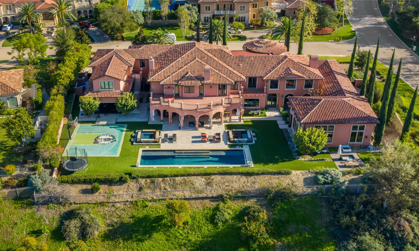 The estate centers on a 12,250-square-foot mansion with six bedrooms, nine bathrooms, a movie theater and bowling alley.
