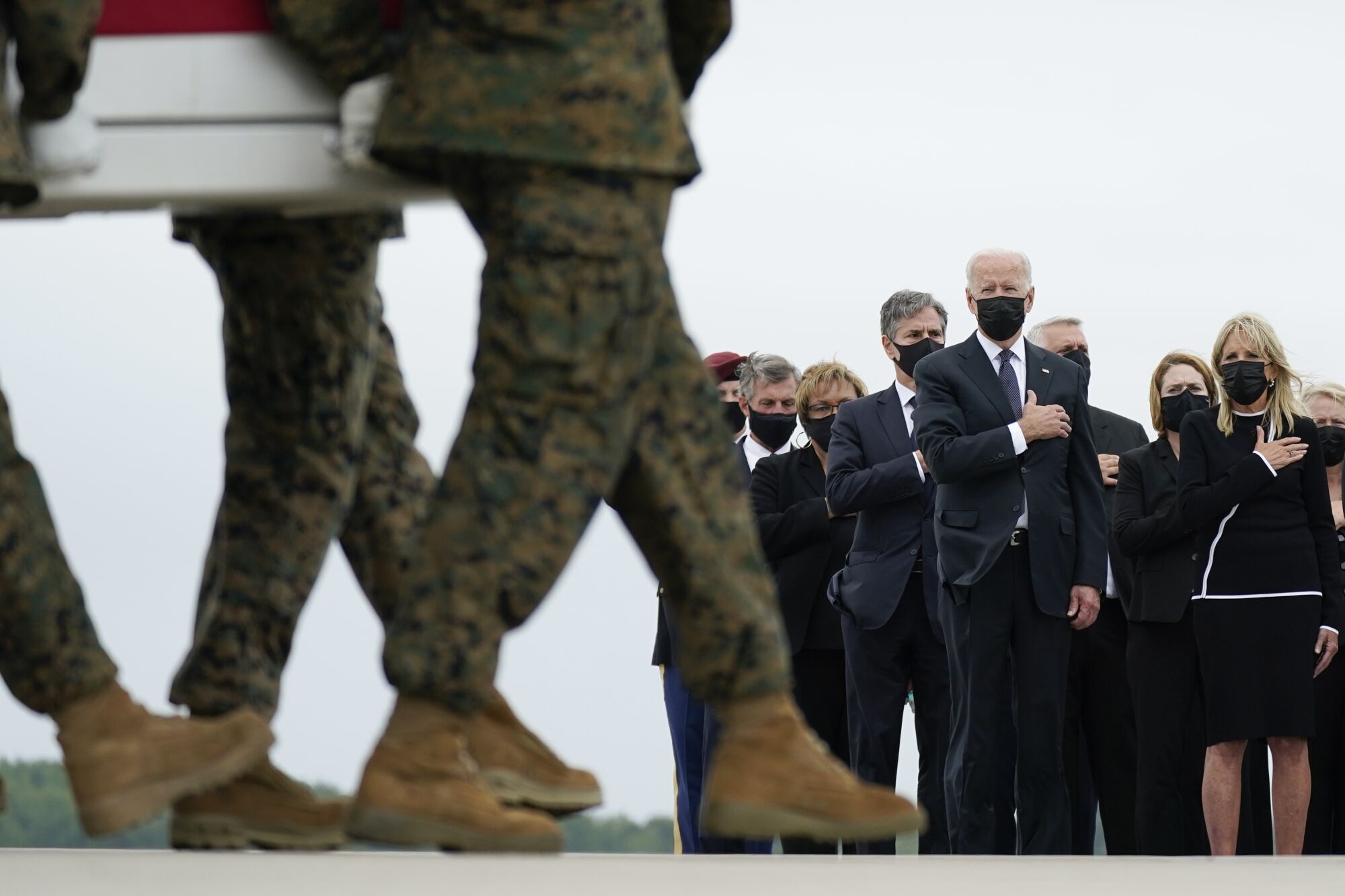 President and Jill Biden watch as the remains of Lance Cpl. Kareem M. Nikoui are transferred