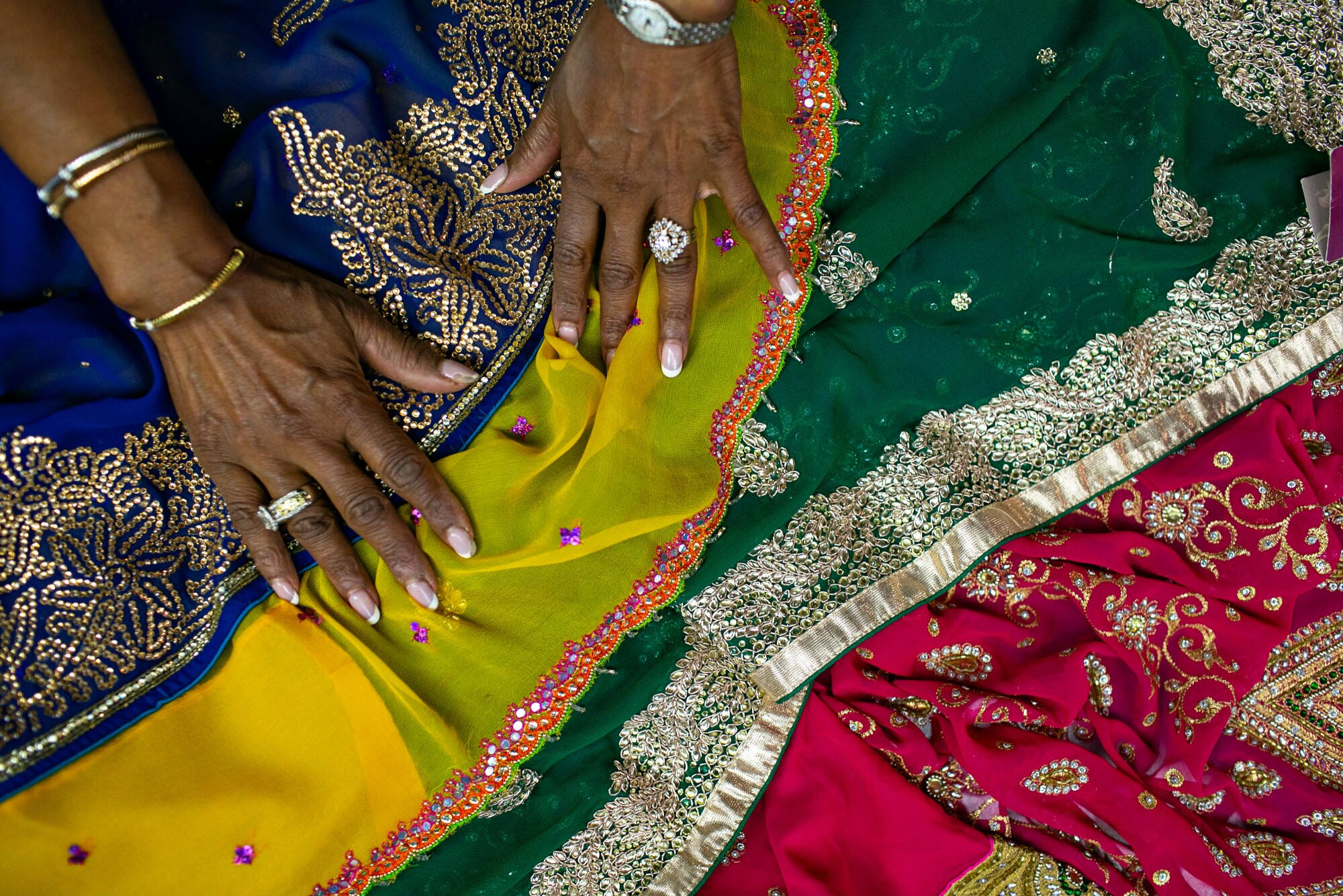 Colorful sari fabrics are shown
