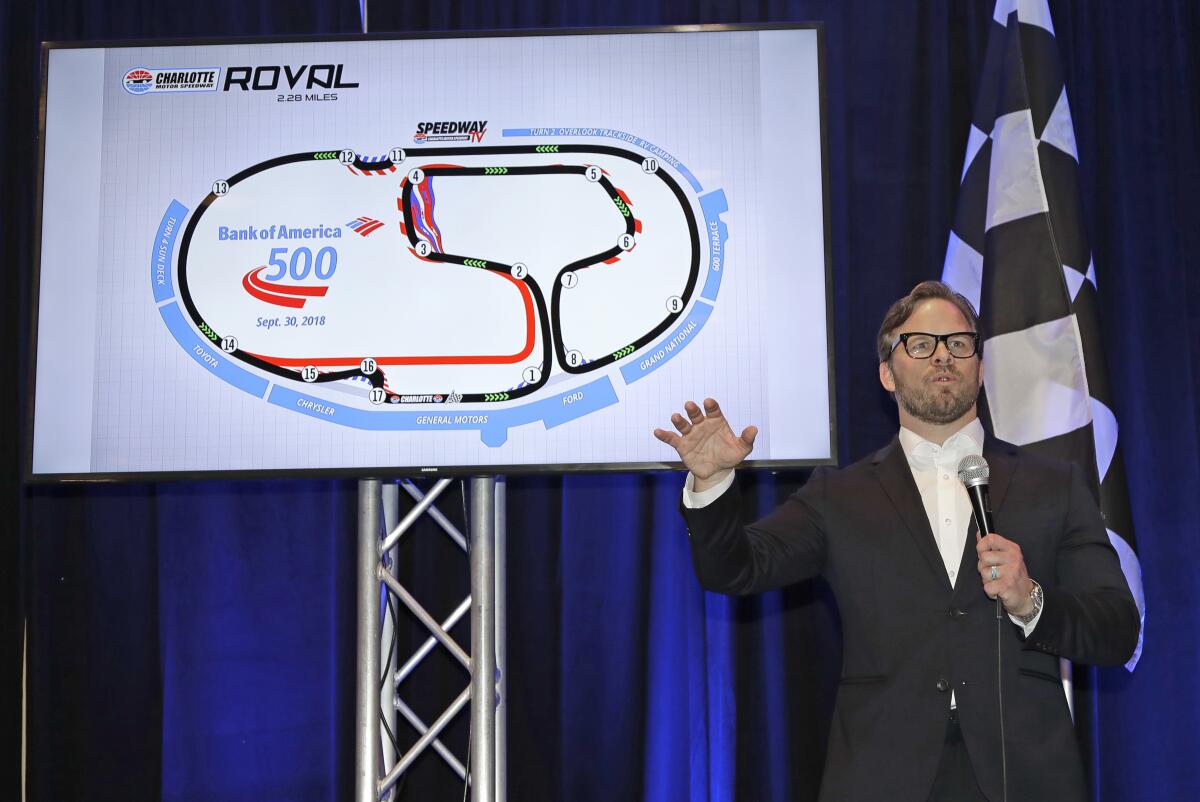 FILE - Marcus Smith, CEO of Speedway Motorsports, talks about the upcoming Bank of America 500 NASCAR Cup series auto race on the new road course during a news conference at Charlotte Motor Speedway in Concord, N.C., in this Monday, Jan. 22, 2018, file photo. NASCAR wanted new energy and ideas this season and Marcus Smith has been pivotal in helping the sport deliver. (AP Photo/Chuck Burton, File)