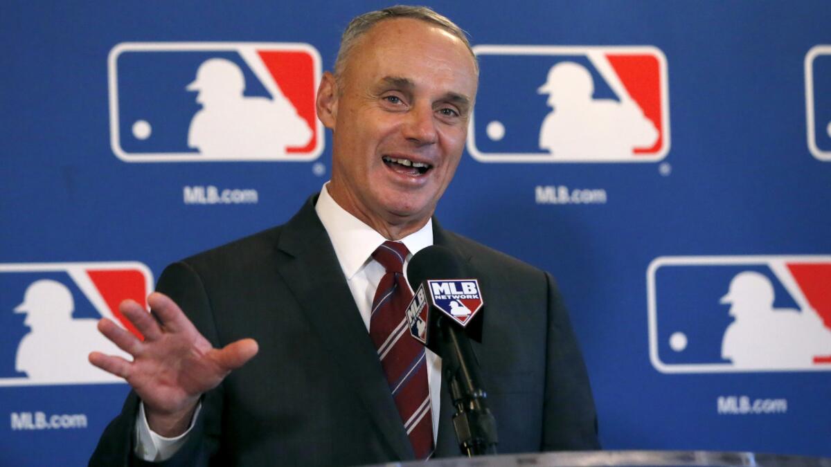 Baseball Commissioner Rob Manfred responds to a question after the baseball owners' quarterly meetings in Chicago on Nov. 17.