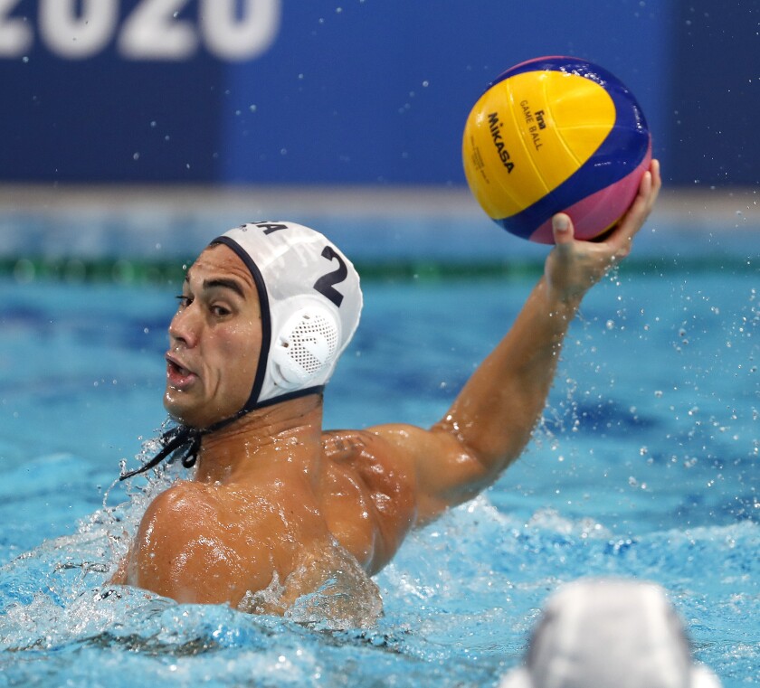 Johnny Hooper passes for the U.S. men's water polo team against Spain on Wednesday.