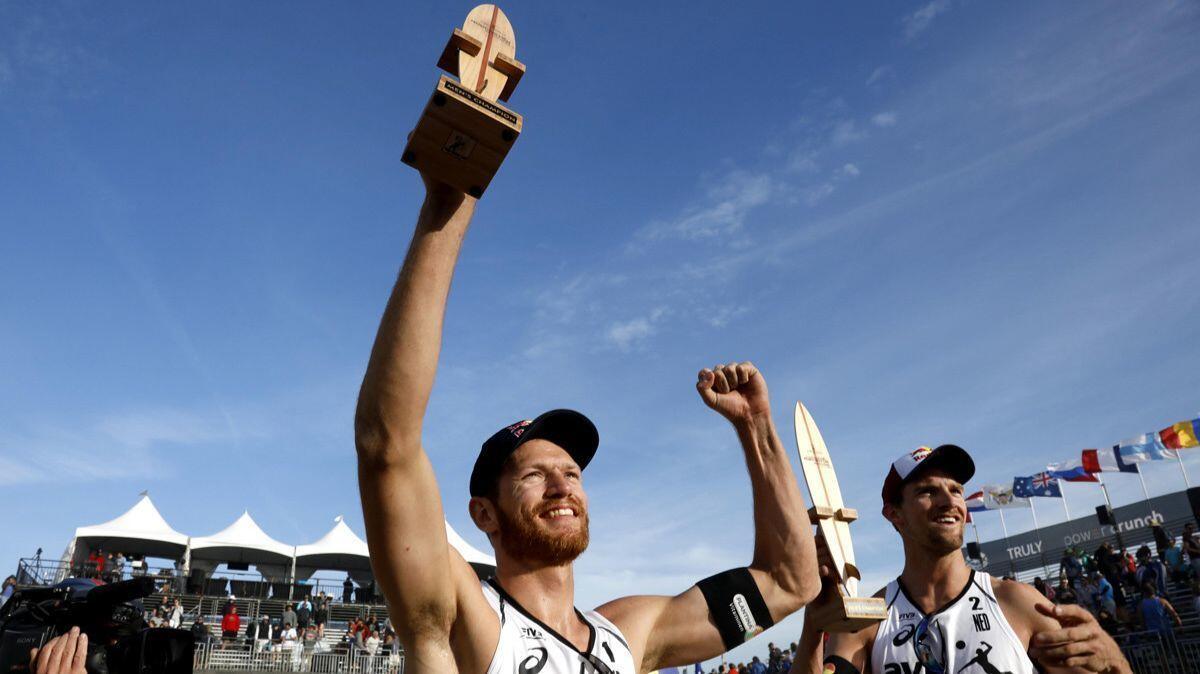 Robert Meeuwsen, left, and Alexander Brouwer celebrate their win in the men's final match at the FIVB Huntington Beach Open on May 6.