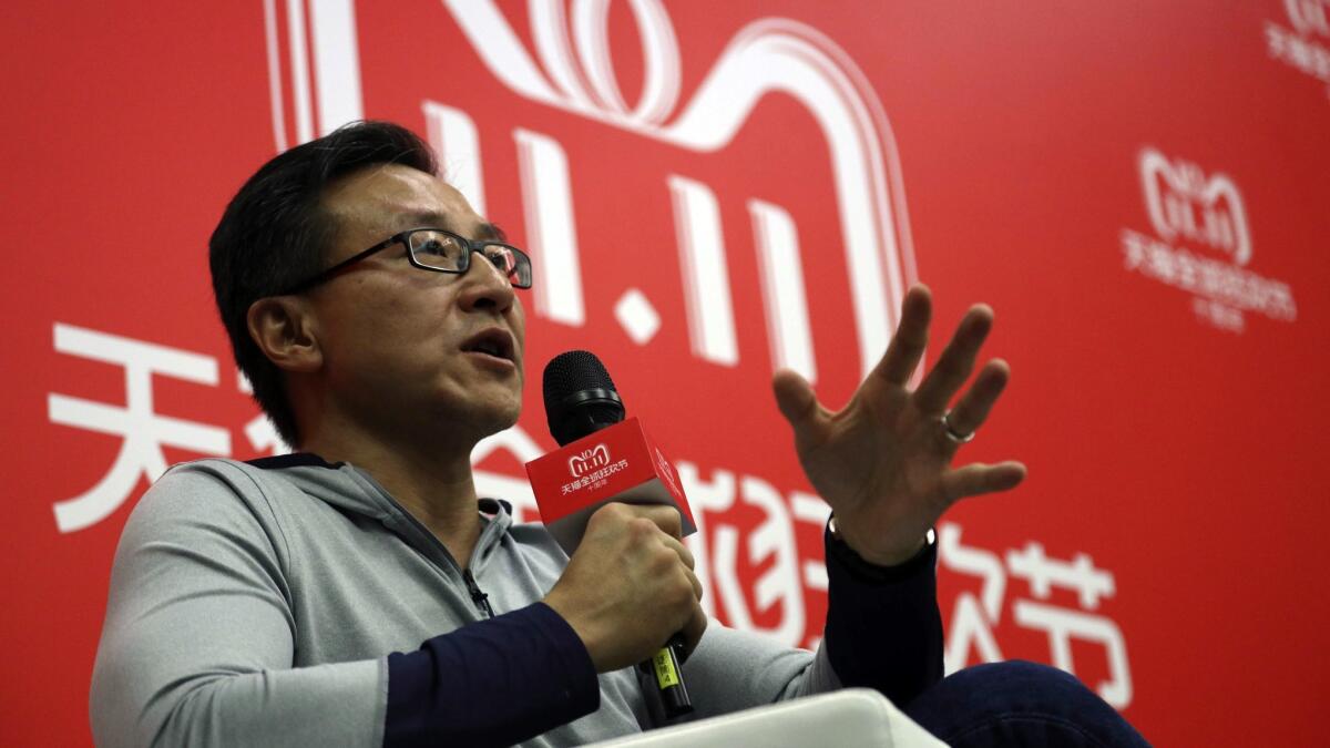 Joe Tsai, executive vice chairman of Alibaba Group speaks to journalists during Alibaba's 11.11 Global Shopping Festival also known as Singles Day in Shanghai, China, Sunday, Nov. 11, 2018.