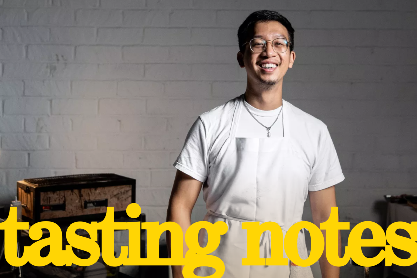 Anajak Thai chef and co-owner Justin Pichetrungsi poses in the kitchen.