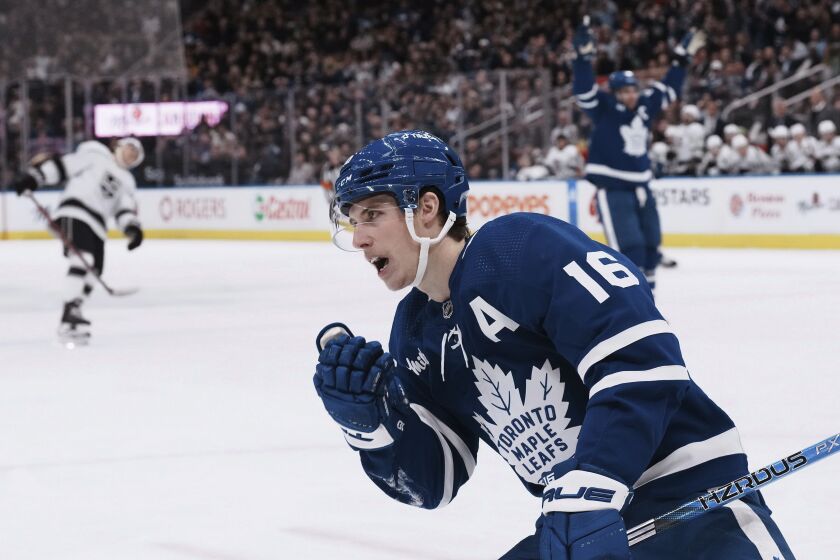 Toronto Maple Leafs' Mitchell Marner celebrates after scoring against the Los Angeles Kings during the second period of an NHL hockey game Thursday, Dec. 8, 2022, in Toronto. (Chris Young/The Canadian Press via AP)