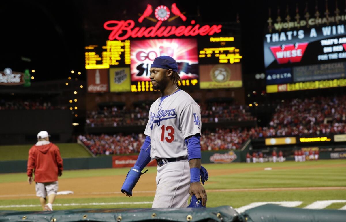 Shortstop Hanley Ramirez walks off the field after the Dodgers were eliminated from the postseason by the Cardinals in Game 4 of the National League Division Series on Monday in St. Louis.