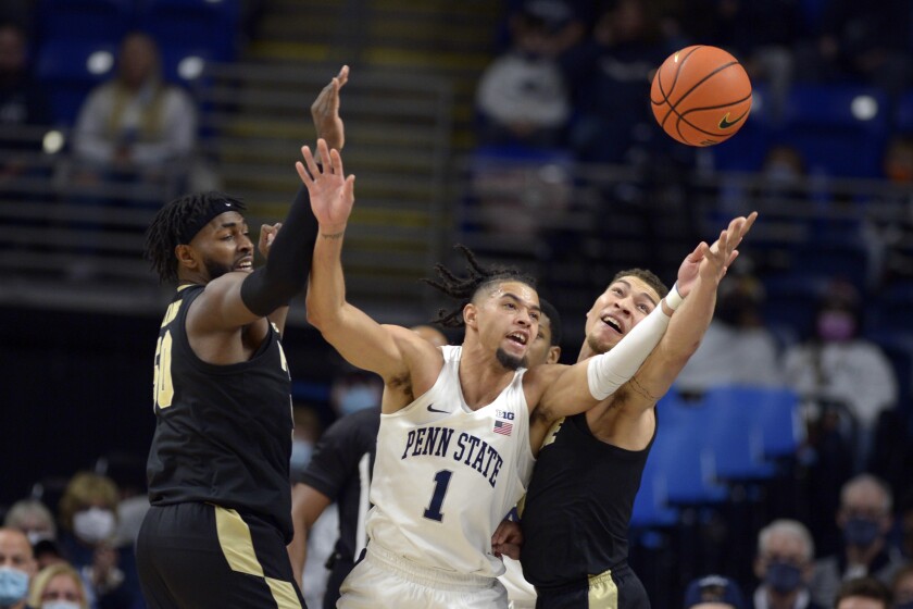Purdue's Trevion Williams (50), Penn State's Seth Lundy (1) and Purdue's Mason Gillis (0) go for a loose ball during an NCAA college basketball game Saturday, Jan. 8, 2022, in State College, Pa. (AP Photo/Gary M. Baranec)