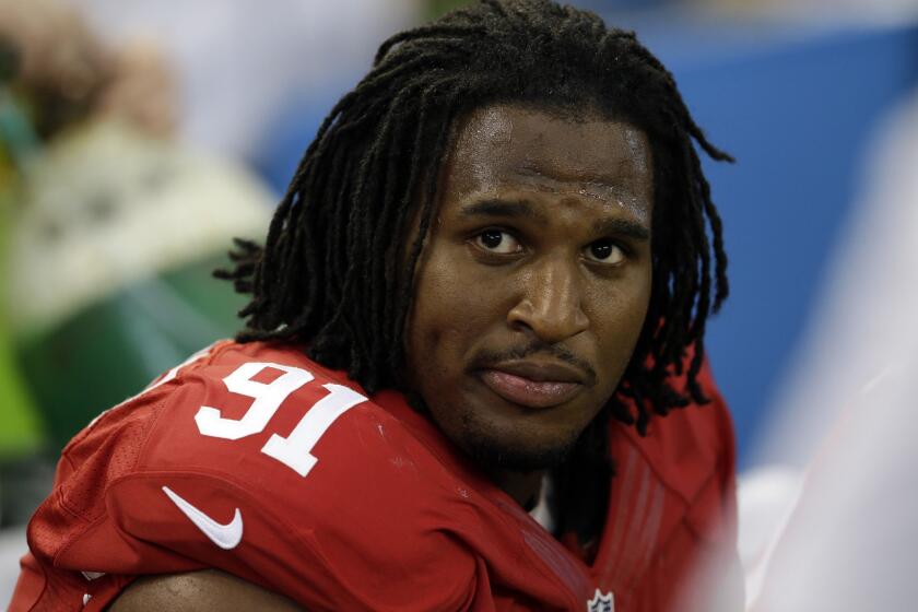 Ray McDonald sits on the bench for the 49ers during a Sept. 7 game against the Dallas Cowboys in Arlington, Texas.