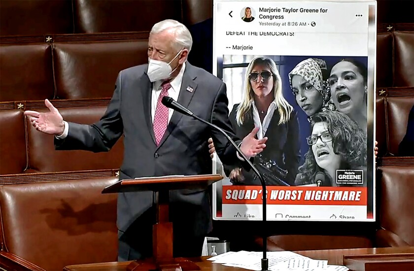 Rep. Steny Hoyer (D-Md.) displays a political ad for freshman Rep. Marjorie Taylor Greene (R-Ga.).