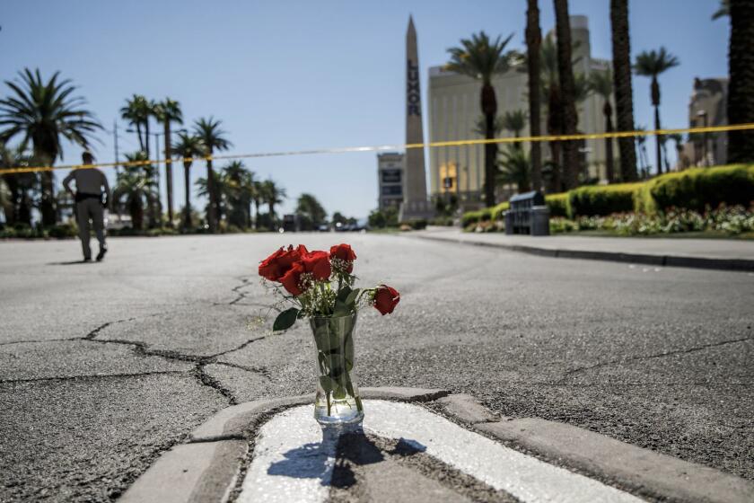 LAS VEGAS, NEVADA -- MONDAY, OCTOBER 2, 2017: A lone vase of flowers left on Las Vegas Blvd. and Reno Ave. for the victims of the mass shooting in Las Vegas, Nevada, on Oct. 2, 2017. (Marcus Yam / Los Angeles Times)