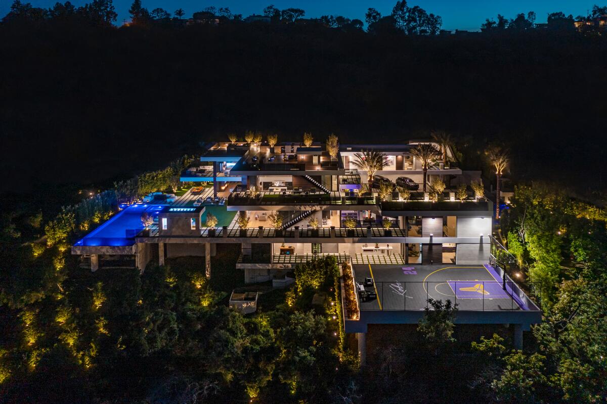 The amenity-loaded mansion includes two pools, a cannabis garden and Kobe Bryant-themed basketball court.