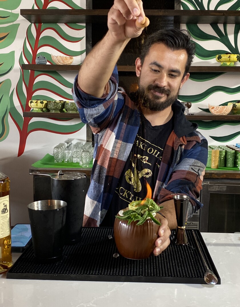 Mixologist Irving Gonzalez prepares the namesake cocktail for Lime in the Coconut in Chula Vista.