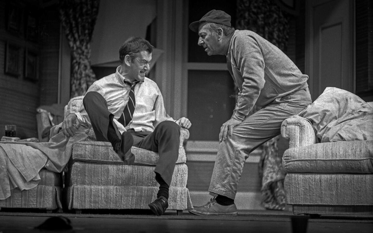 Felix Unger (Tony Randall) throws a fit as a concerned but relaxed Oscar Madison (Jack Klugman) looks on in "The Odd Couple," Neil Simon's comedy, playing in December 1975 at the Shubert Theatre in Los Angeles.