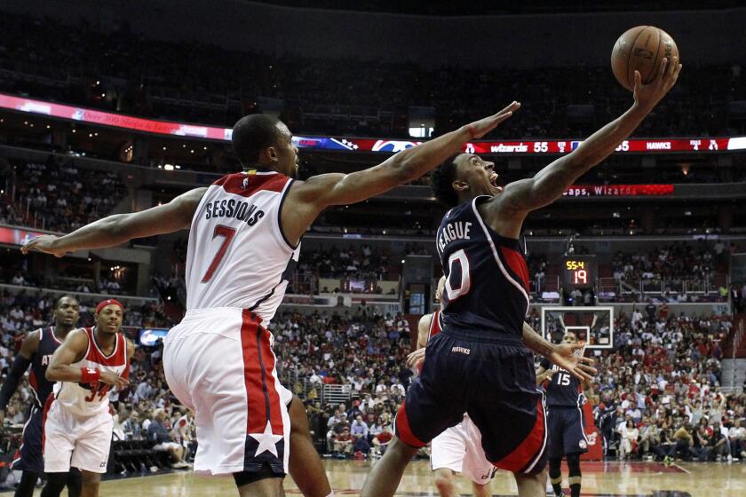 Hawks point guard Jeff Teague scored a game-high 26 points, including two on this reverse layup against Wizards point guard Ramon Sessions.