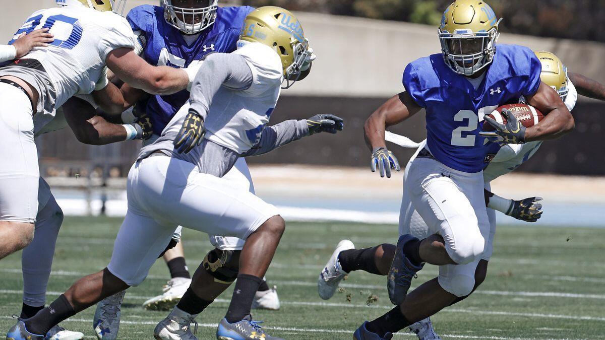 UCLA running back Joshua Kelley looks for room to run during the Bruins' spring football game at Drake Stadium on April 21.