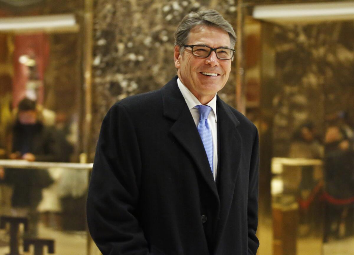Former Texas Gov. Rick Perry smiles as he leaves Trump Tower in New York on Dec. 12, 2016.