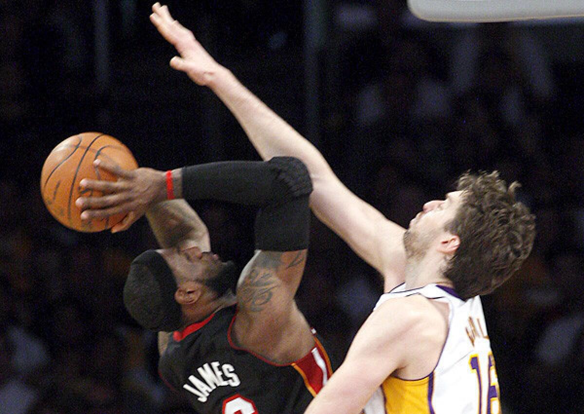 Sinco, Luis ¿¿ B581939098Z.1 LOS ANGELES, CA. ¿ MAR. 4, 2012 ¿ Heat forward LeBron James gets fouled by Lakers forward Pau Gasol in the second quarter Sunday, Mar. 4, 2012, at Staples Center in Los Angeles.