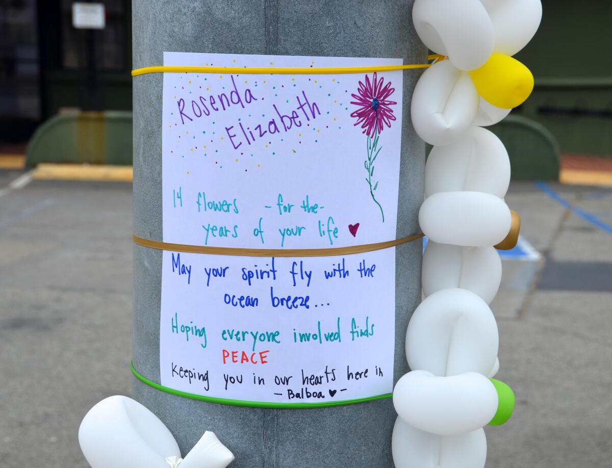 A message and balloon flowers for Rosenda Smiley, struck by a car Saturday evening one block from the Balboa Fun Zone.