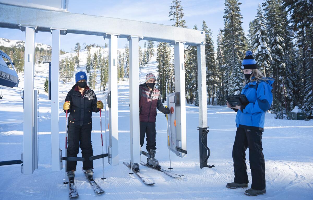 Skiers pass through newly installed RFID gates at Lake Tahoe's Sugar Bowl Resort