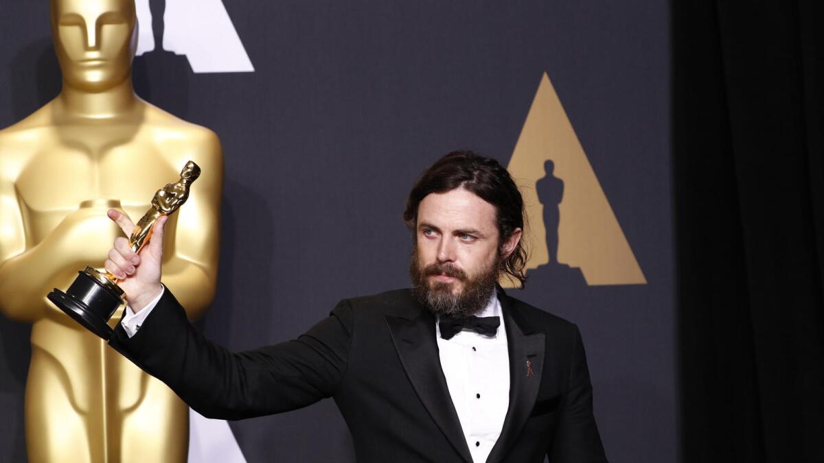 Casey Affleck with his Oscar for supporting actor.