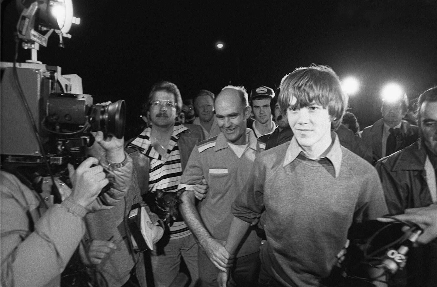 Steven Stayner, right, and and his brother Delbert Stayner walk toward their Merced County home as Steven was reunited with his family following a 7-year kidnap ordeal.