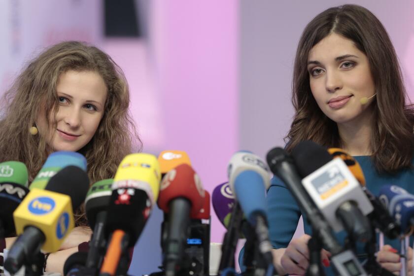 Nadezhda Tolokonnikova, right, and Maria Alekhina, members of the Russian punk band Pussy Riot, at a news conference Dec. 27 after their release from prison.