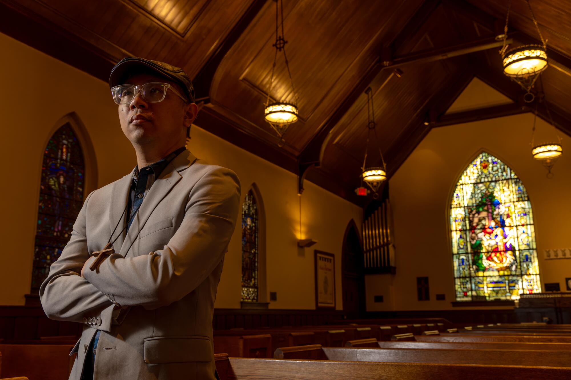Eric Chen, shown inside Church of Our Savior, is a pastor and speech and debate coach at Gabrielino High School.