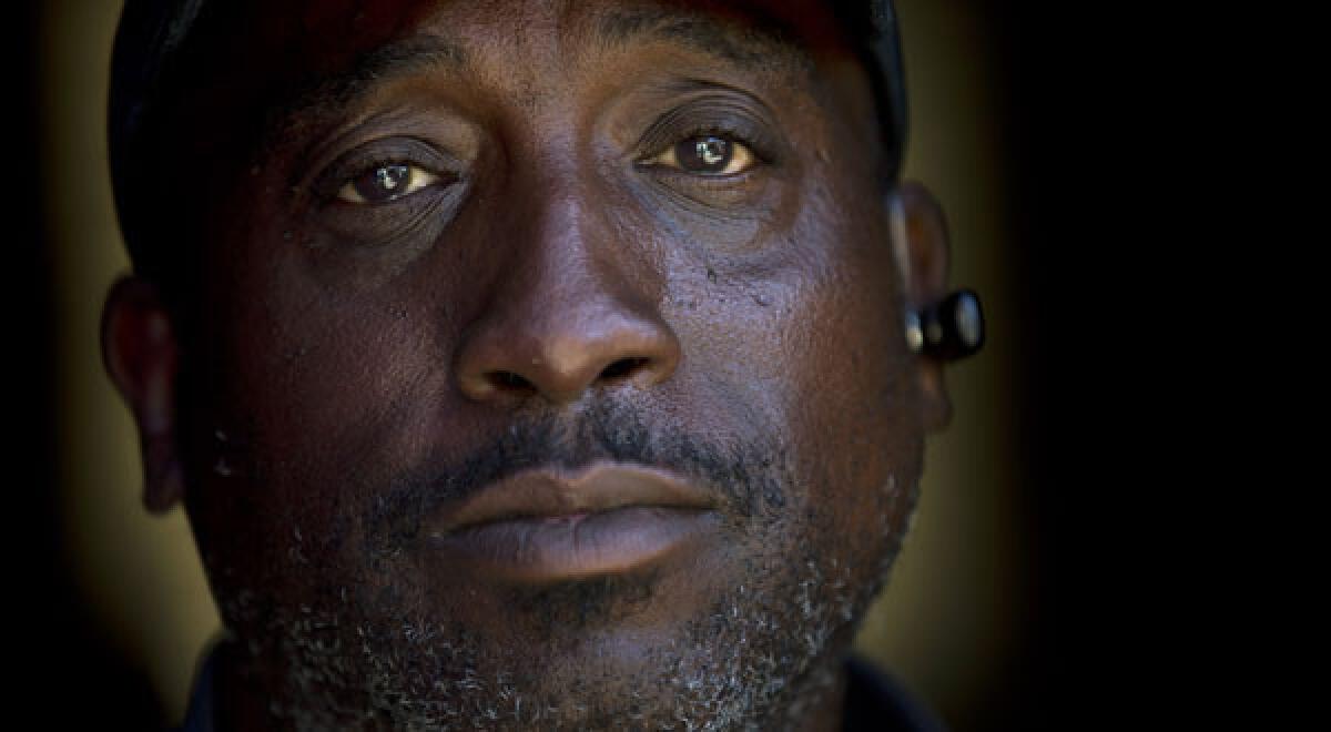 Homeless veteran Jerome Belton poses for a portrait at a shelter in San Diego. Homelessness among veterans and in general is down nationwide.