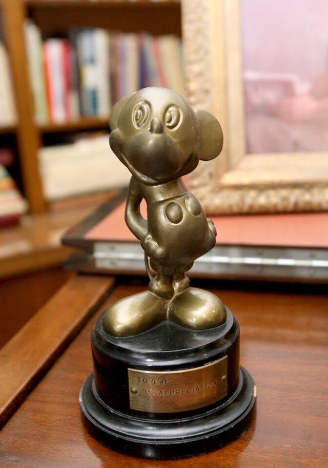 To celebrate the 75th anniversary of the Walt Disney Studios in Burbank, the Walt Disney Archives restored Walt Disney's original office suite, which was shown to members of the media on Tuesday, December 22, 2015. Above, Disney used to give these awards to his employees, but this one was given to Disney by his brother Roy Disney. The space is located in the original Animation building and was occupied by Walt Disney from 1940 to 1966, when he passed away at the age of 65 from lung cancer. The permanent exhibit will be opened to Disney employees, cast members and studio visitors and it will be added to tours of the studio lot that gold members of the official fan club, D23, can take.