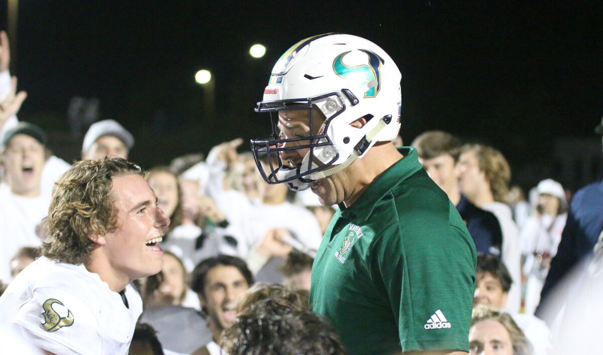 Maverick Head Coach Sean Sovacool celebrates with team postgame.