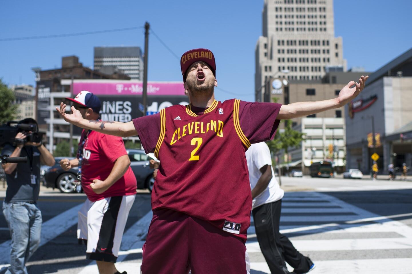A Cavaliers fan reacts to the news of LeBron James' return in Cleveland, Ohio