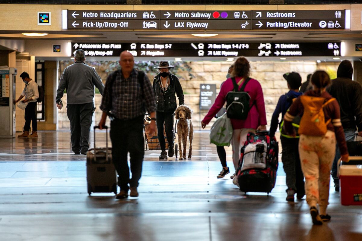 Travelers make their way through L.A.’s Union Station on Wednesday.