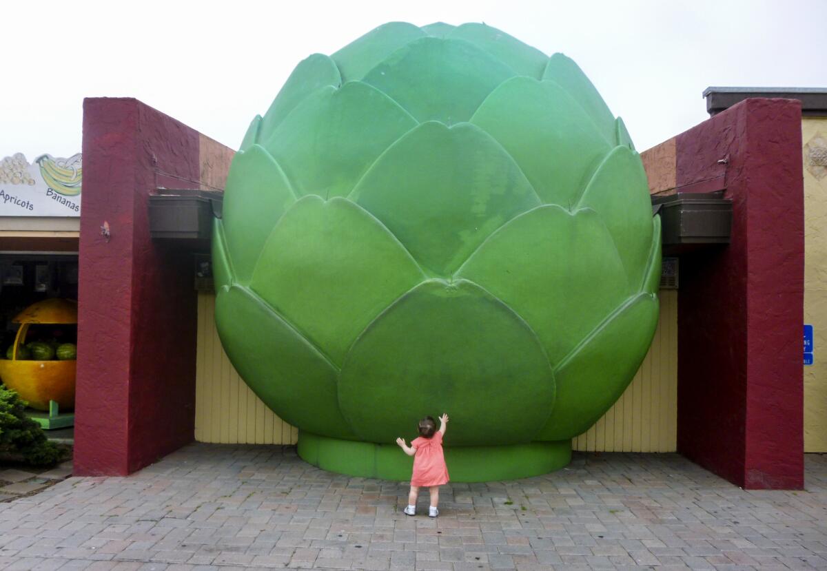 A little girl checking out the Giant Artichoke of Castroville.