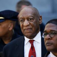 FILE - In this April 26, 2018 file photo, Bill Cosby, center, leaves the the Montgomery County Courthouse in Norristown, Pa., after being convicted of drugging and molesting a woman. The actor has spent more than two years in prison since he was convicted of sexual assault in the first celebrity trial of the #MeToo era. Now the Pennsylvania Supreme Court is set to hear his appeal of the conviction on Tuesday, Dec. 1, 2020. The arguments will focus on the trial judge's decision to let five other accusers testify for the prosecution. (AP Photo/Matt Slocum, File)