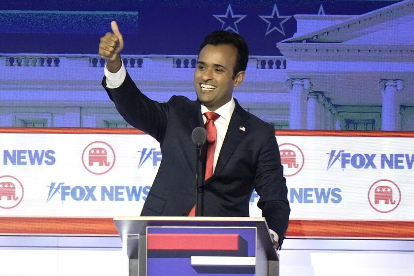 Businessman Vivek Ramaswamy reacts after a Republican presidential primary debate hosted by FOX News Channel Wednesday, Aug. 23, 2023, in Milwaukee. (AP Photo/Morry Gash)
