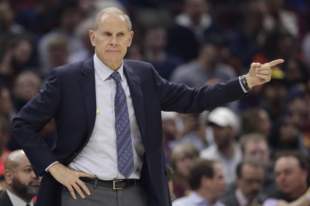 FILE - In this Friday, Dec. 20, 2019 file photo, Cleveland Cavaliers head coach John Beilein gives instructions to players in the first half of an NBA basketball game against the Memphis Grizzlies in Cleveland. Cavaliers first-year coach John Beilein will end a rough season by stepping down after 54 games, according to multiple reports Tuesday, Feb. 18, 2020.(AP Photo/Tony Dejak, File)