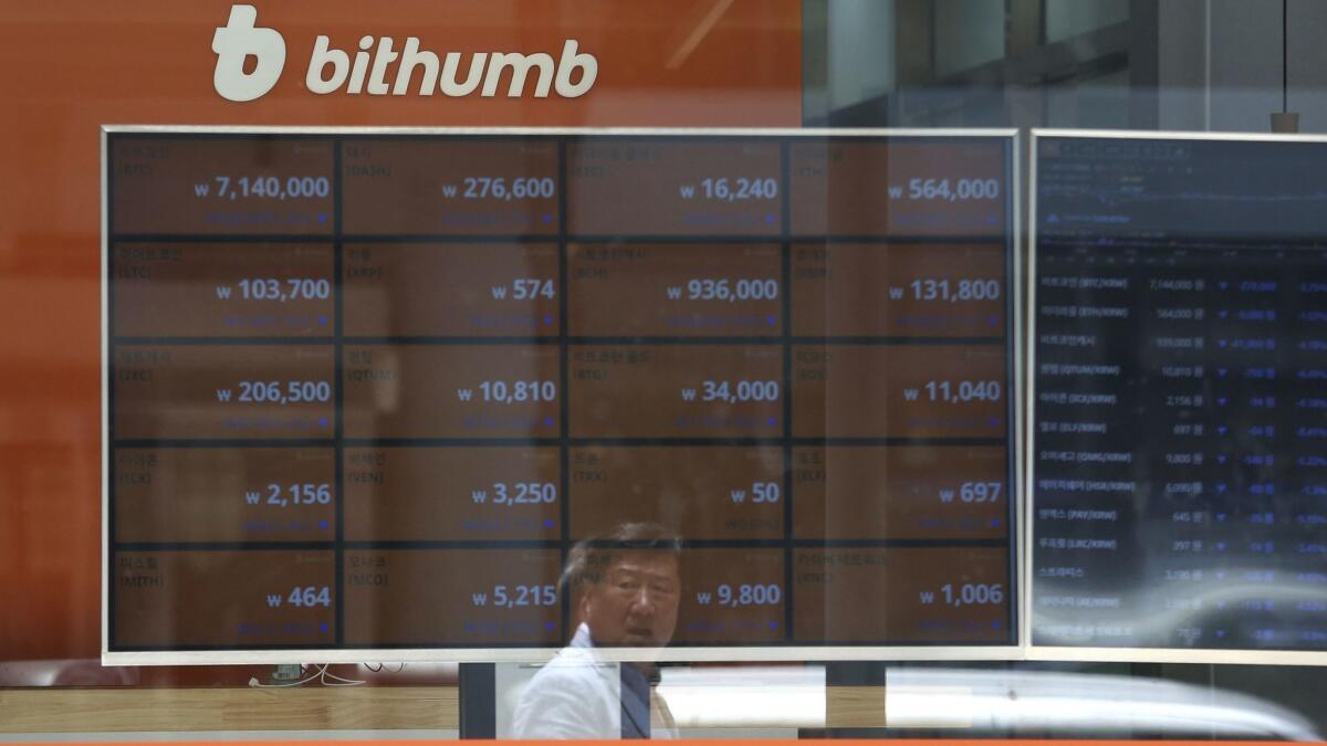 A screen shows the prices of bitcoin at the Bithumb cryptocurrency exchange in Seoul. The exchange, South Korea's second-largest, said Wednesday that $31 million worth of virtual currencies have been stolen by hackers.