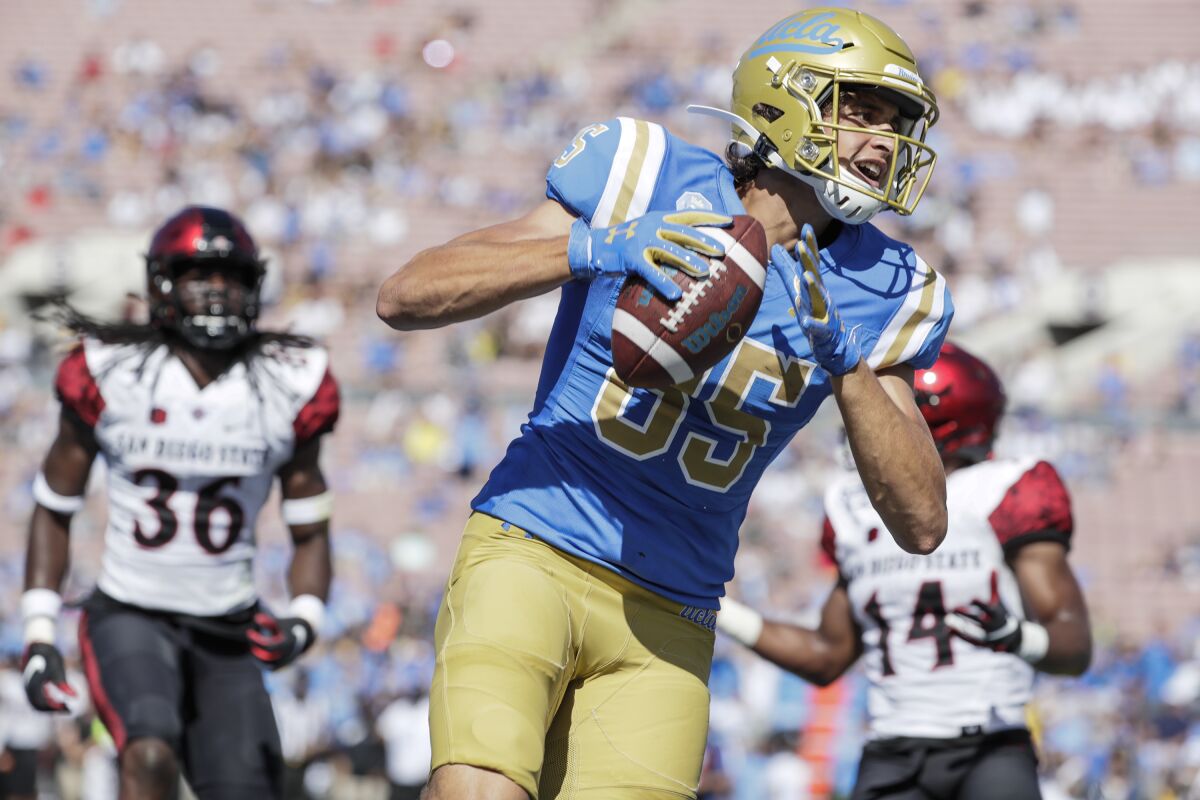 UCLA's Greg Dulcich scores a touchdown against San Diego State. 