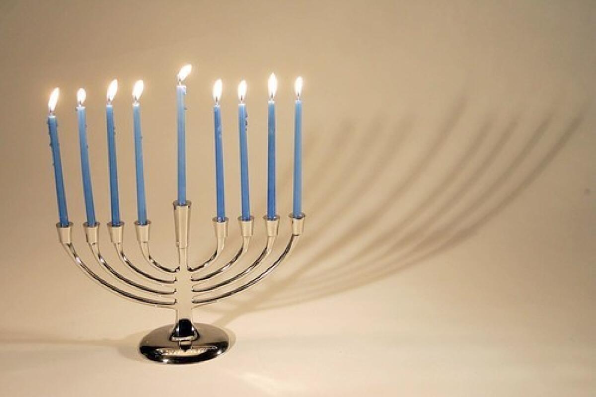A menorah with all nine candles lit. 