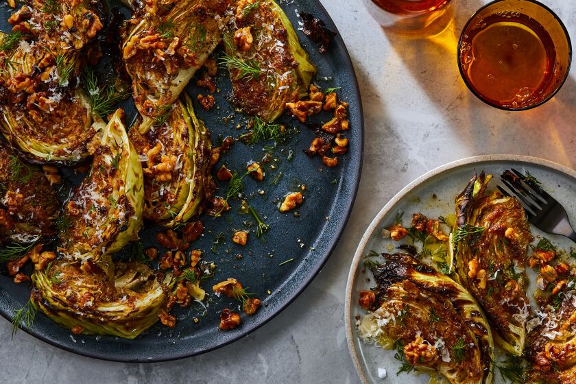 Roasted cabbage wedges on a plate.