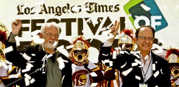 L.A. Times Publisher Eddy Hartenstein, left, and C.L. Nikias, president of USC, celebrated the Saturday opening of the Festival of Books, held for the first time on the USC campus.