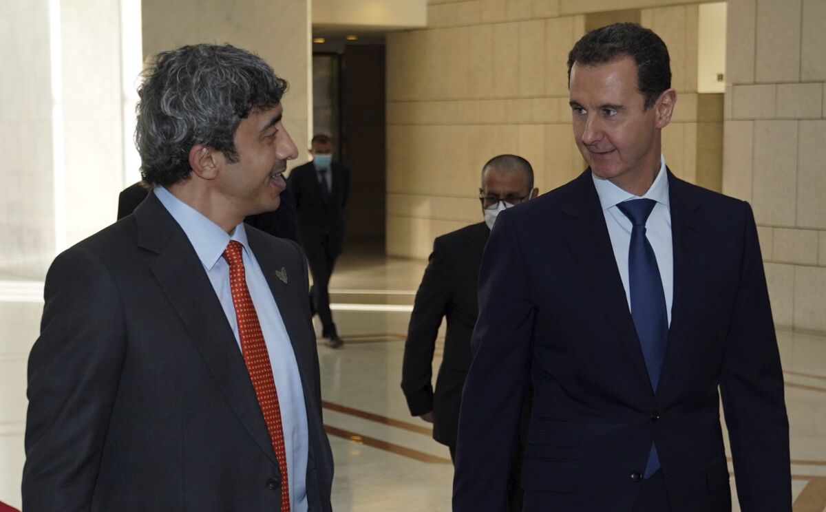 In this photo released by the Syrian official news agency SANA, shows Syrian President Bashar Assad, right, speaks with Sheikh Abdullah bin Zayed Al Nahyan, the Foreign Minister of the United Arab Emirates, in Damascus, Syria, Tuesday, Nov. 9, 2021. Al Nahyan's visit to Syria is the first time since the Syrian conflict began a decade ago and comes as some Arab countries are improving relations with Syria. The UAE has been slowly mending ties with Damascus, as the tide of the war has turned in favor of President Bashar Assad. (SANA via AP)